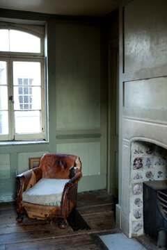 Old leather chair in panelled