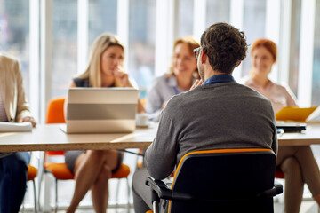 A young male applicant having an interview for a job with a company commission. People, job, company, business concept.