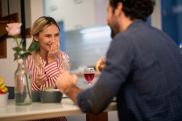 A young girl excited about having a lunch with her boyfriend at home. Love, relationship, together