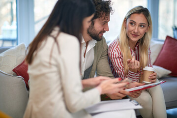 A group of young business people at a meeting discussing data from documents. People, business, meeting