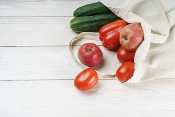 Light linen eco bag with fresh vegetables and fruits