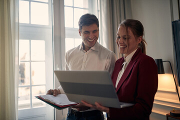 Young modern couple preparing for a business meeting