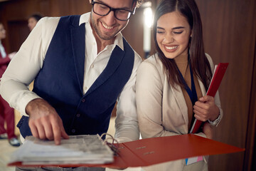 Colleague hotel coworkers consulting together