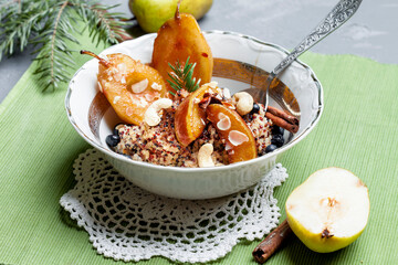 
quinoa porridge with caramelized pear and berries. morning breakfast