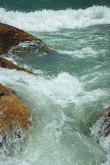 waves crashing on rocks