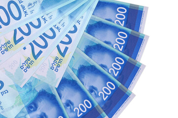 200 Israeli new shekels bills lies isolated on white background with copy space stacked in fan...