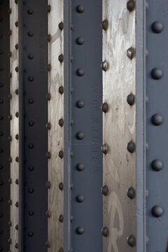Rivet detail, metal studs on a wall