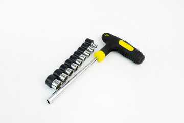 Screwdriver with a set of bits on a white background