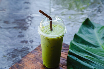 Iced green tea in takeaway cup