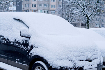 Winter. Car littered with snow