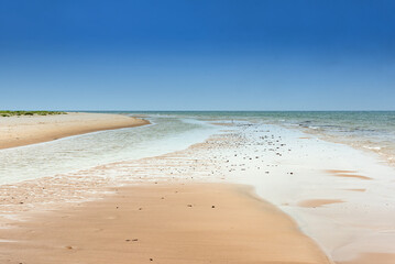 Empty sandy beach near Norra Austen on the Swedish island Fårö in the Baltic Sea in summer. Long-term exposure