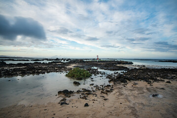 Rocky coast of northern Lanzarote at low tide on a cloudy day