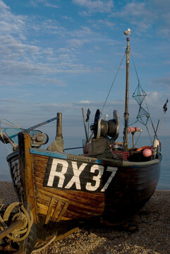 Fishing boat on pebble beach