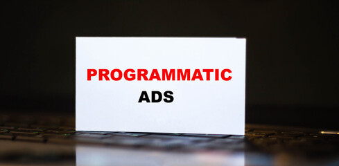 PROGRAMMATIC ADS on a computer with a dark background.