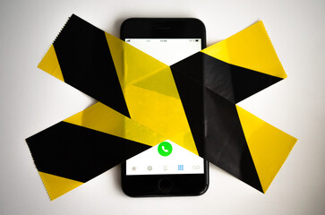 The smartphone is sealed with a forbidding film of black and yellow color. use of the phone is...