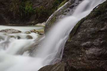 Fototapeta na wymiar water flowing in a mountain creek