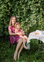 mother and child play in the garden