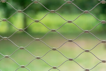 Fototapeta premium Braided wire fence - close-up photography