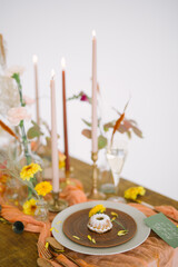 table setting for autumn wedding with candles