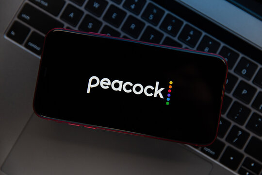 Tula, Russia - November 11, 2020: Peacock logo on iPhone display