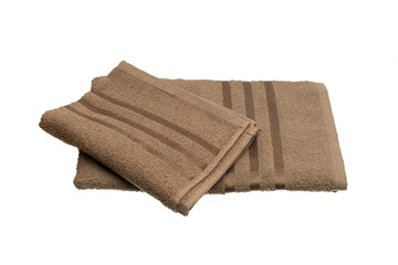 Fototapeta na wymiar stack of brown towels isolated on white.