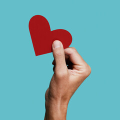 man with a red heart in his hand