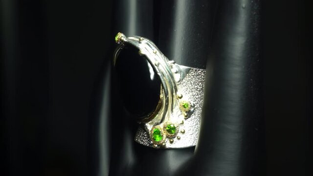 silver ring with natural spinel and chrome diopside on the hand
