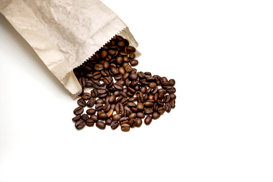 Pack with heart-shaped coffee beans. White background.
