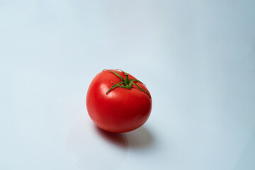 red tomato on a white background