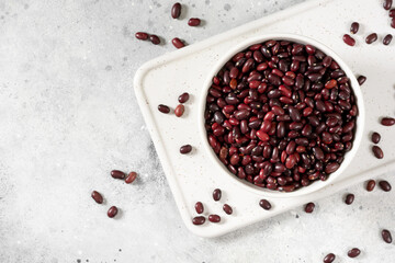 Red beans. Raw red beans in a ceramic bowl on a light gray kitchen table. Organic Natural Vegetarian product