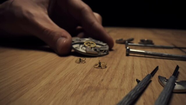 Mechanical watch repair with special tools, watchmaker's workshop