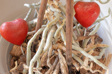 Orchid root with two red hearts