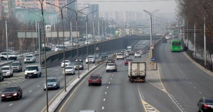 Daytime city, busy traffic on the highway. Time-lapse. 4K, 4096 X 2160, 30 fps