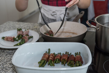 Cook Prepares Bacon Fish In The Pan As A Vegetable Kitchen