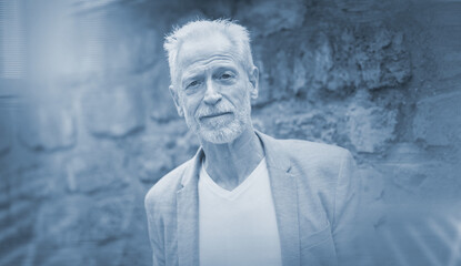 Fototapeta premium Portrait of handsome mature man; light effect