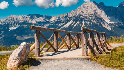Beautiful alpine summer view with a wooden bridge at the famous Astberg summit, Going, Wilder Kaiser, Tyrol, Austria