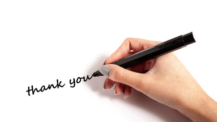 Female hand writing a Thank you sign