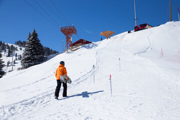 Fototapeta na wymiar Snowboarder On The Skiing Slope