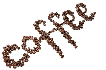 Word coffee written in grains. White background.