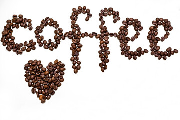 Word coffee written in grains. White background.
