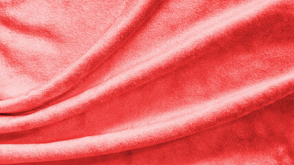 Red velvet background or velour flannel texture made of cotton or wool with soft fluffy velvety...