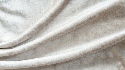 Beige velvet background or velour flannel texture made of cotton or wool with soft fluffy velvety satin fabric cloth metallic color material - obrazy, fototapety, plakaty