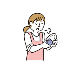 皿洗いしながらため息をつく女性