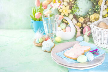 Happy Easter concept with easter eggs in basket and spring flowers. Easter background with copy space and photo frame. Happy Easter  greeting card background
