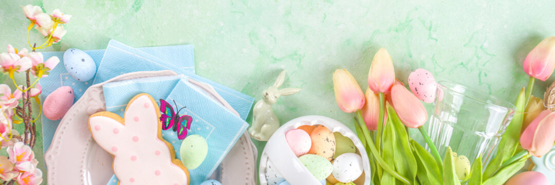 Happy Easter concept with easter eggs in basket and spring flowers. Easter background with copy space and photo frame. Happy Easter  greeting card background