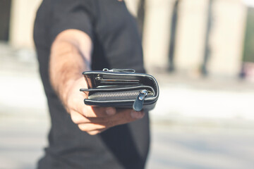 man with wallet in hand, black wallet