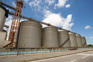 Metal silos for storage of agricultural products in the Port of Santos, Brazil. © willbrasil