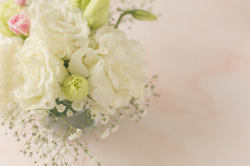 bouquet of white flowers on marble top table