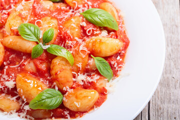 Italian homemade potatoes gnocchi with tomatoes sauce