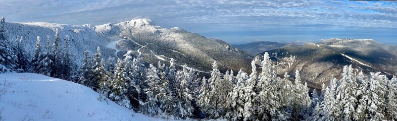 Panoramic mountain view of beautiful mountain peaks at snow day on the top of Stowe Mountain Ski...